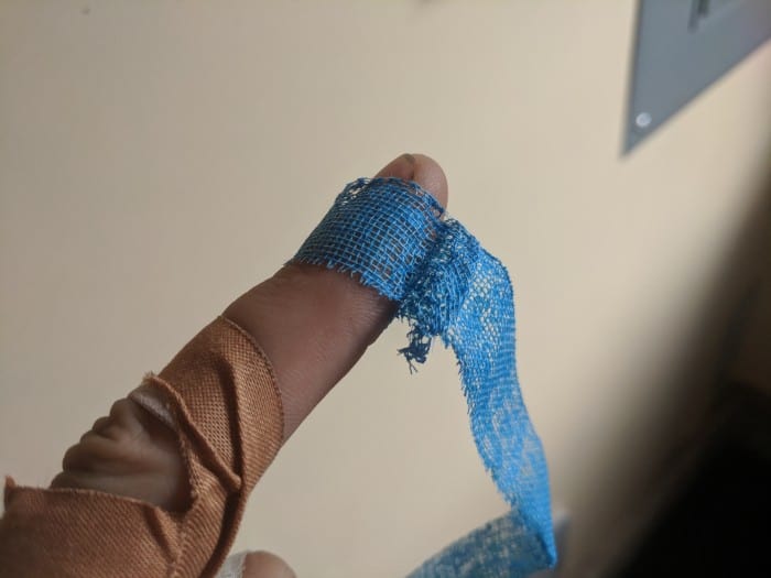 The Evolv Magic Finger Tape wrapped around a fingertip